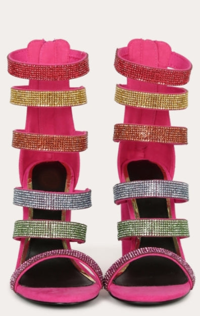 Fuchsia Rhinestone cage sandal heels feature an open toe silhouette, with multi color sparkling rhinestone ladder straps, back zipper, a semi chunky heel, with lightly cushioned insole.